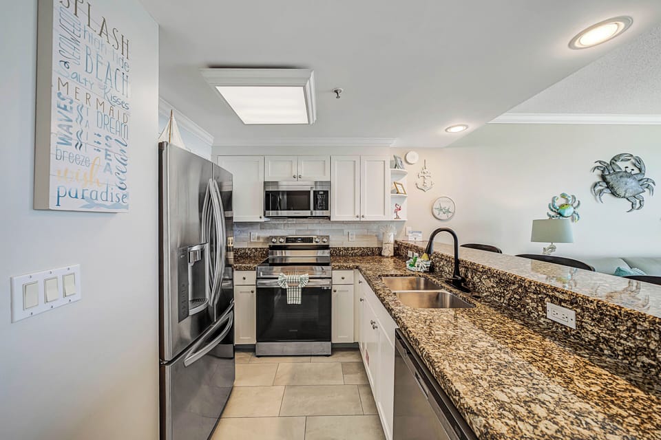 The fully equipped kitchen features stainless-steel appliances, granite countertops, and has everything you need to prepare meals for family & friends.