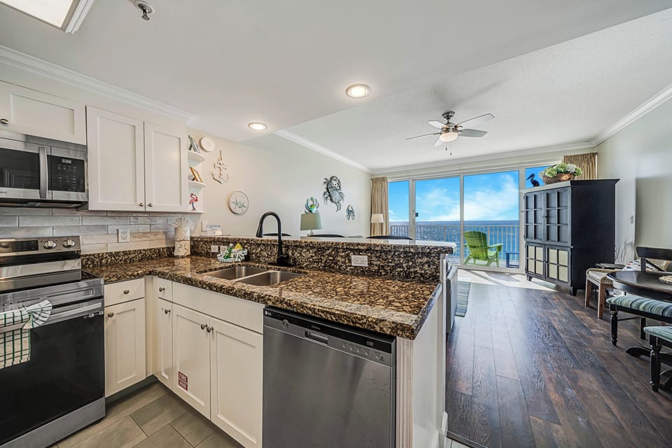 The fully equipped kitchen features stainless-steel appliances, granite countertops, and has everything you need to prepare meals for family & friends.