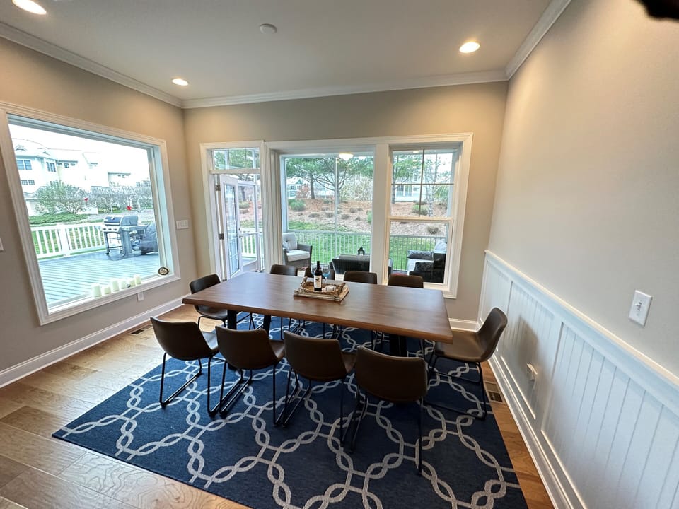 Life edge dining table next to kitchen seats up to 10 people