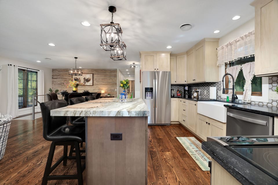 Open kitchen with barstool seating.