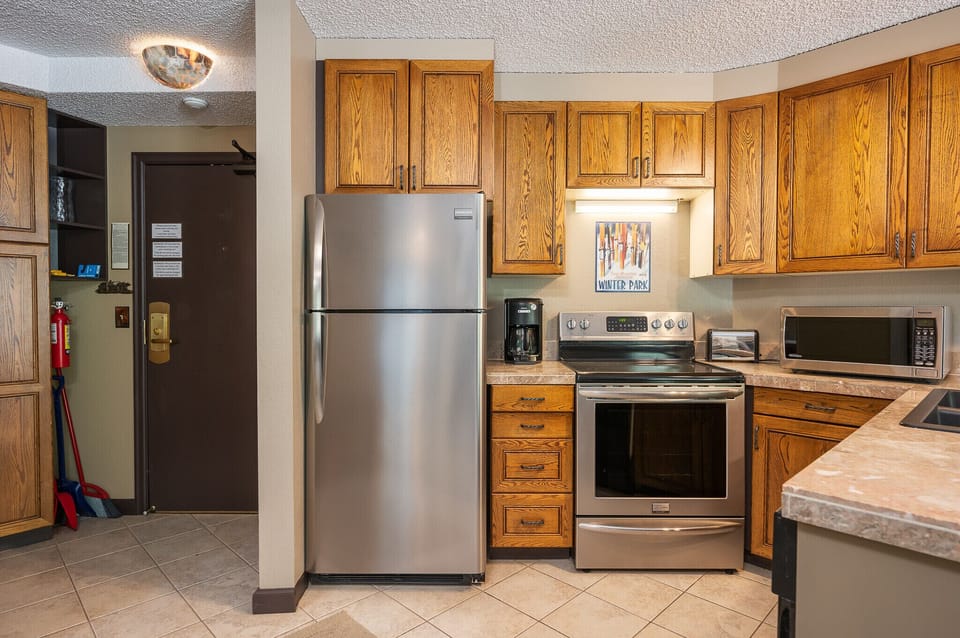 View of kitchen and entry
