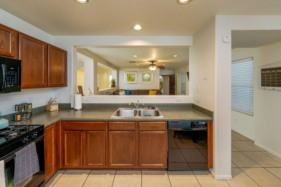 Updated, well-equipped kitchen looks into the living room