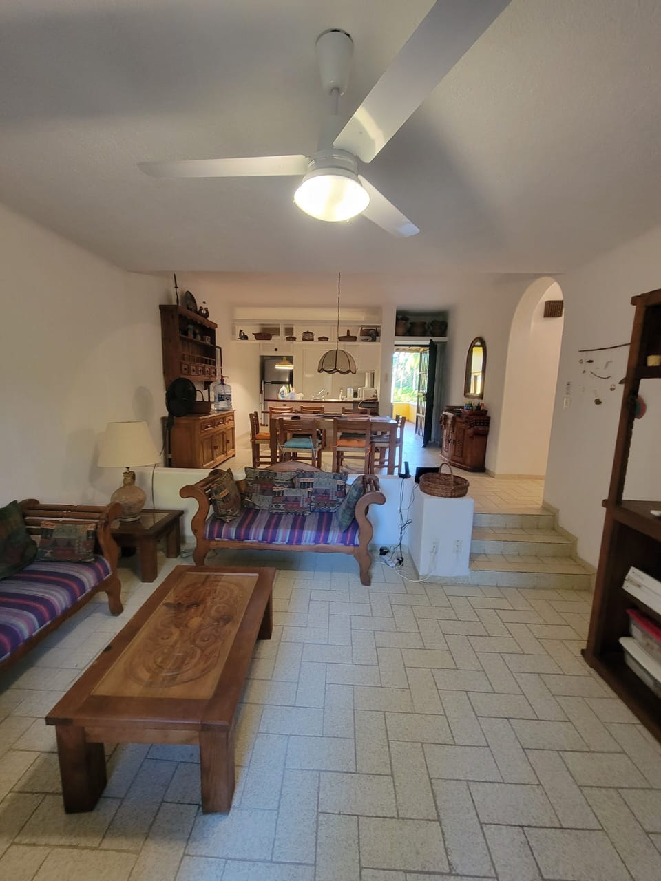 Living room, kitchen and front door from deck doors