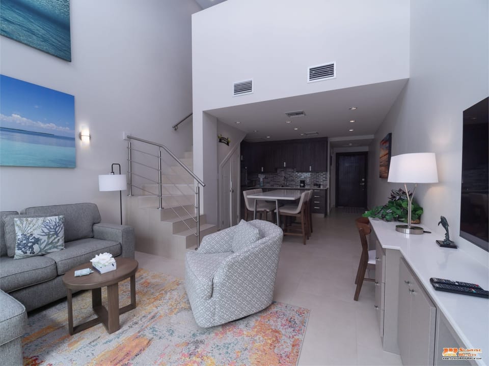 View of unit with Master Bedroom stairway.