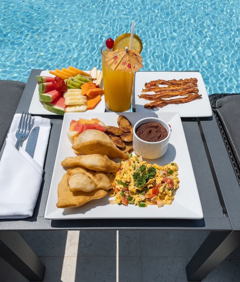 Rain Restaurant provides poolside service from their amazing menu!