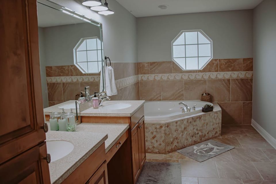 Bathroom 2 - jetted tub and double sinks. Also has separate shower and toilet. 
