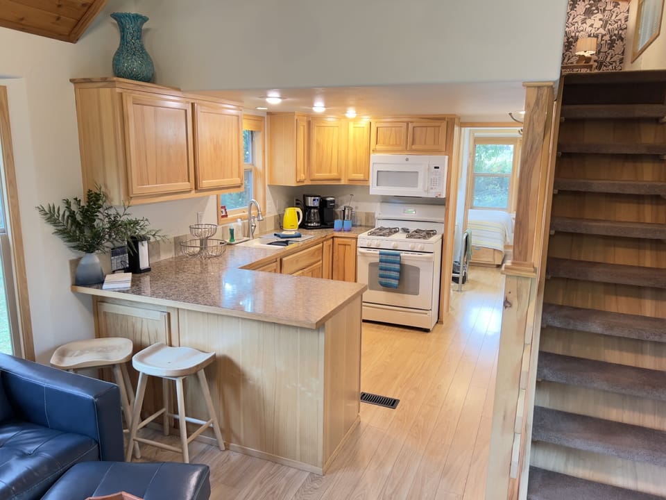 Fully equipped kitchen with breakfast bar and open layout