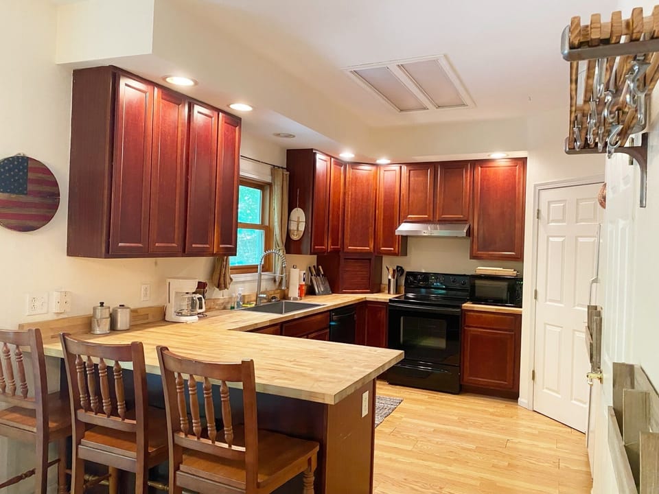 The kitchen has lots of cabinets, a pantry and plenty of countertop space.