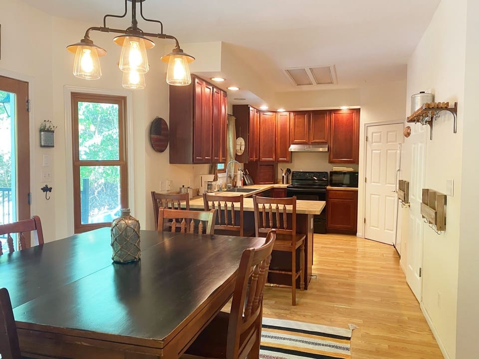 The kitchen has lots of natural light and plenty of dining space.