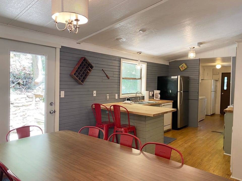 Enjoy views of the woods from the dining room.