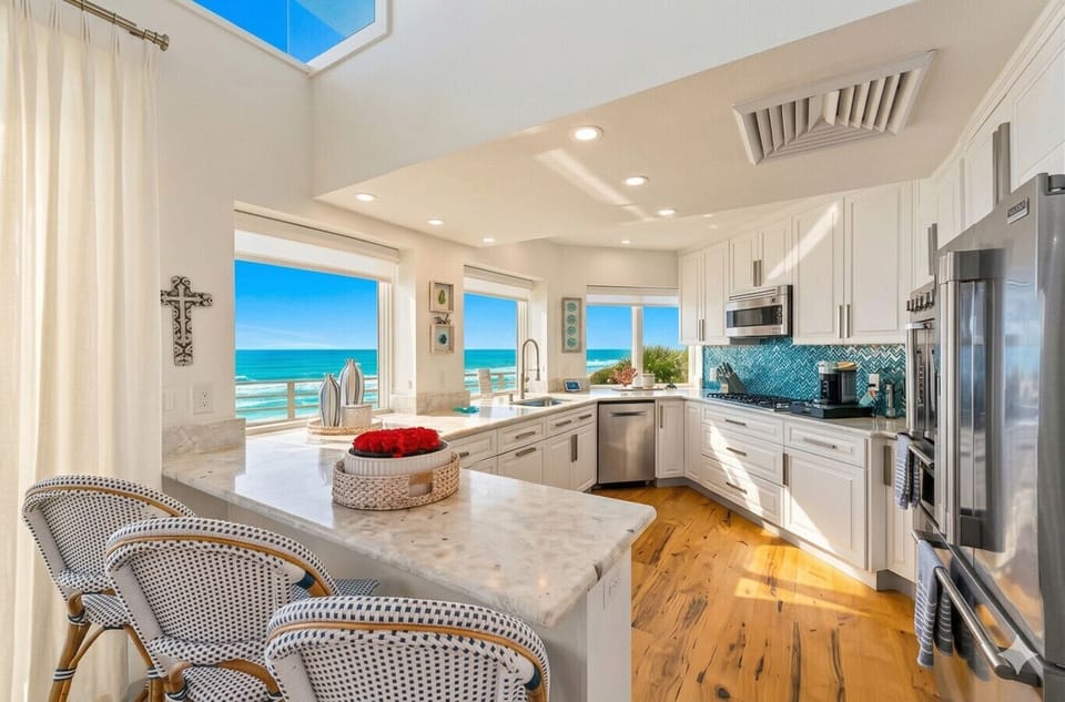 Chef’s Kitchen with a View. Fully stocked and ready for big family dinners with seating for 10.