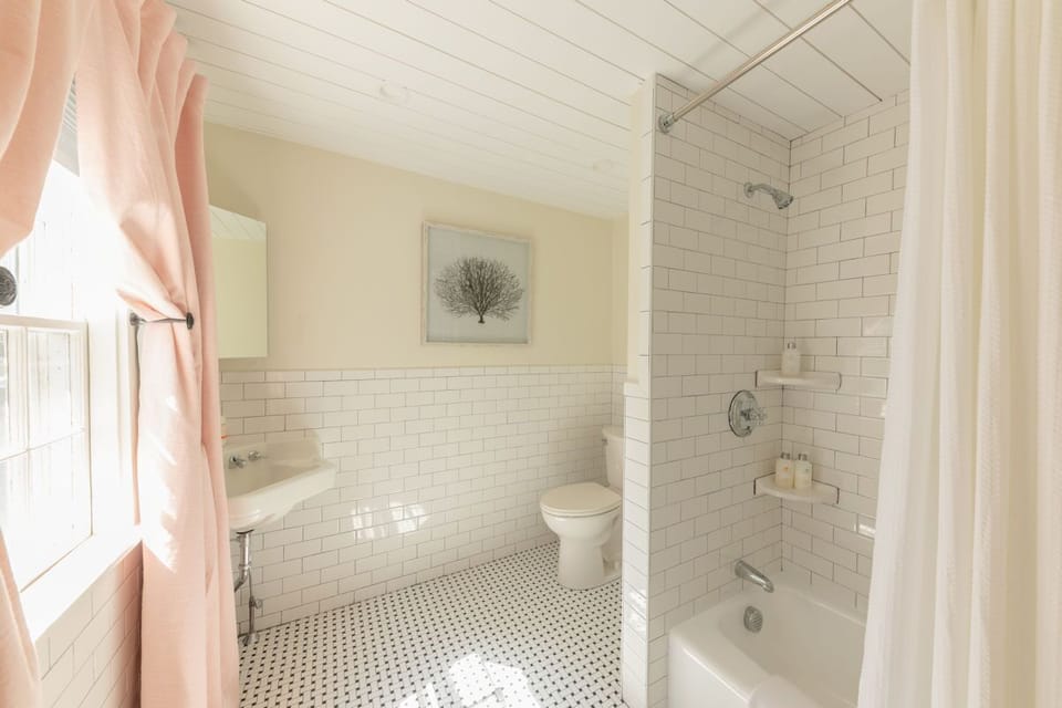 Separate tub and shower, hair dryer, bathrobes, towels