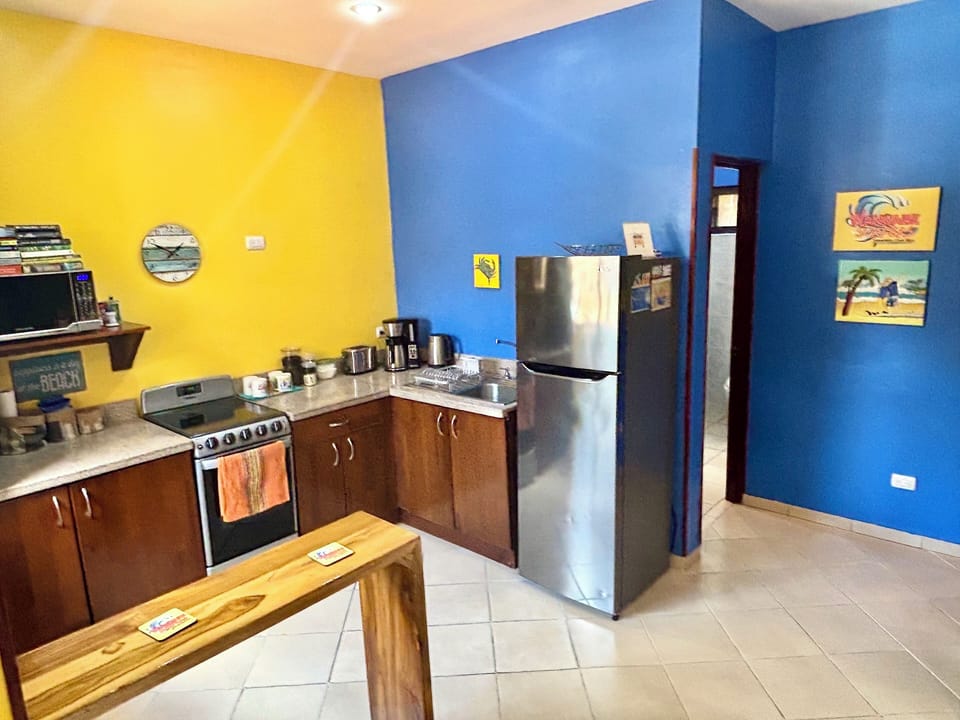 Fully equipped kitchen includes a microwave, blender, toaster and coffee maker