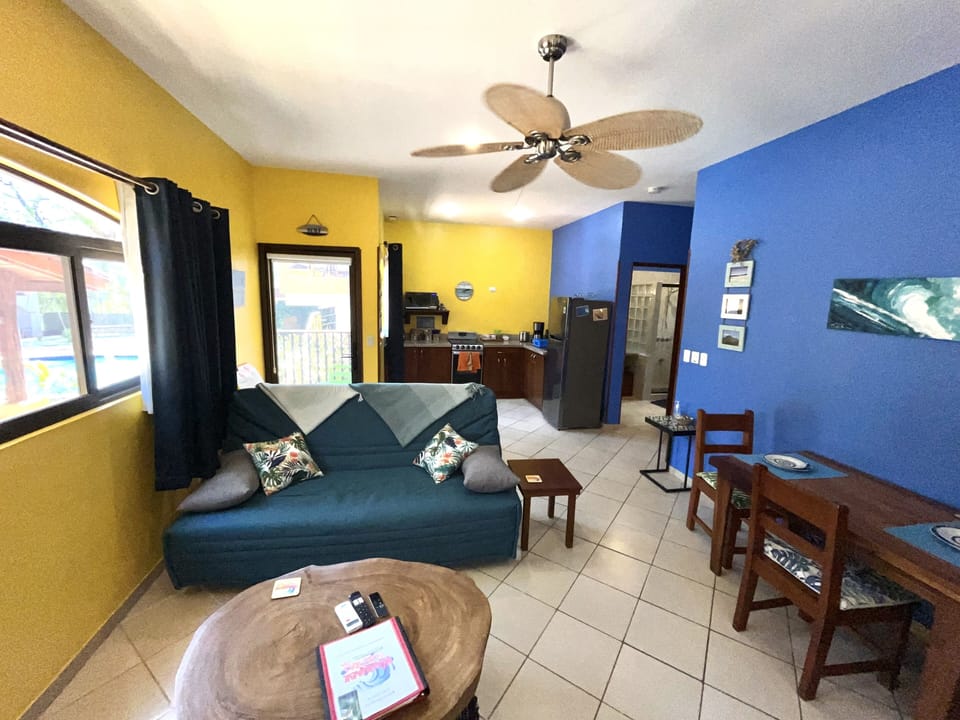Open concept Living room/Dining room and Kitchen with black out curtains