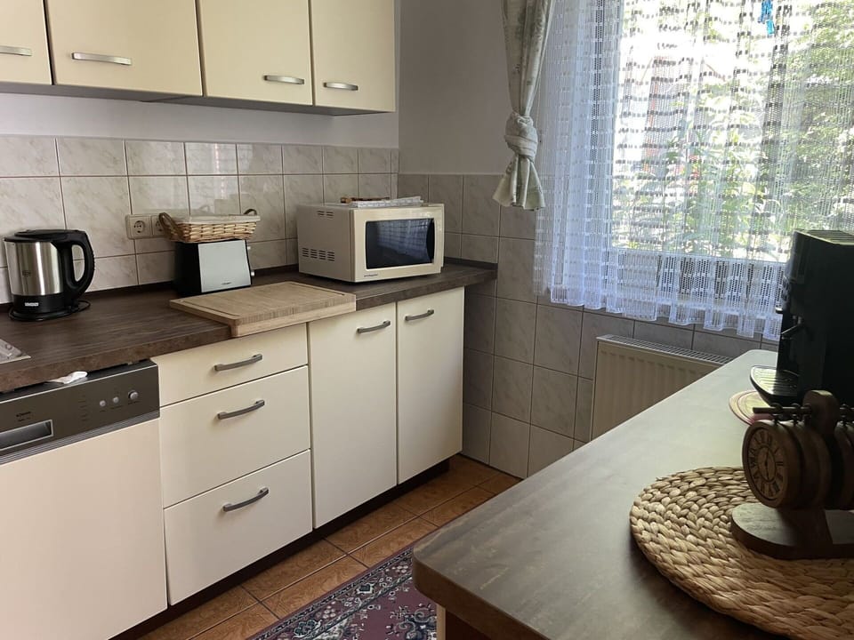 Cabinetry, Property, Table, Furniture, Countertop, Window, Building, Drawer, Lighting, Kitchen