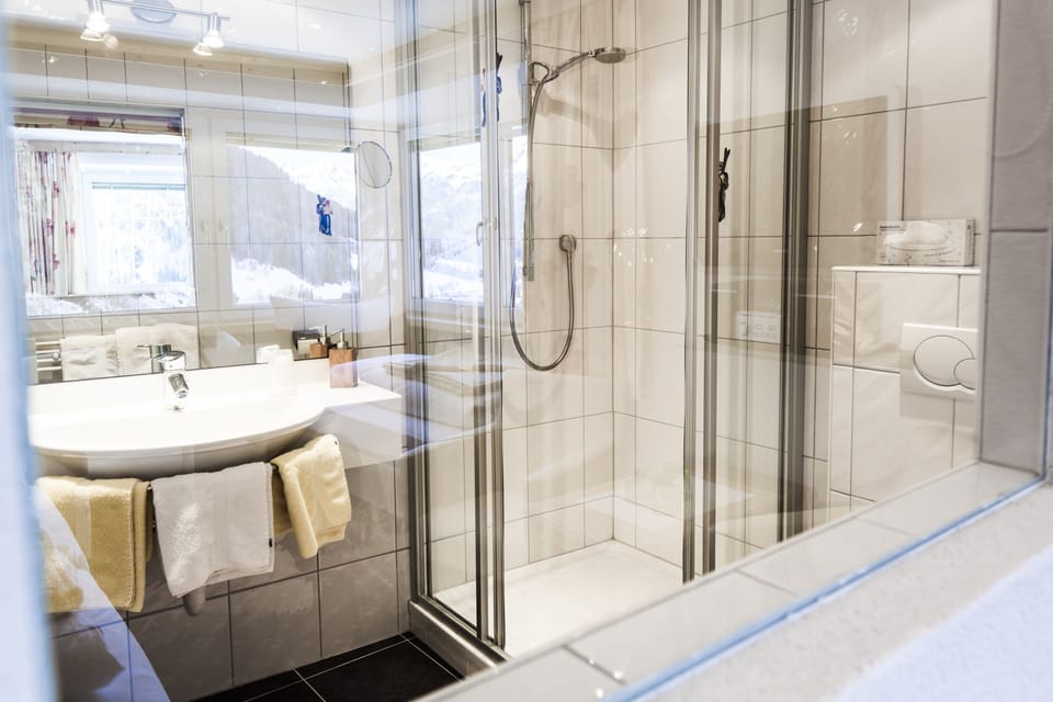 Designer toiletries, hair dryer, bathrobes, slippers