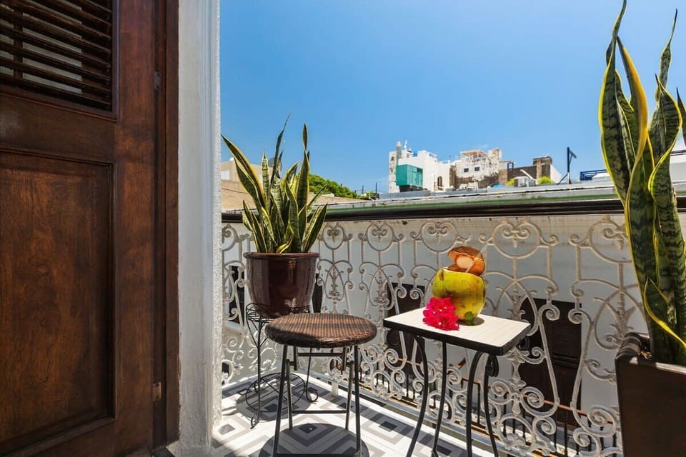 Balcony overlooking traditional cobblestone street
