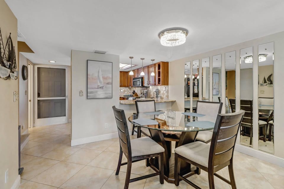 The dining space is separated from the kitchen by a granite eating bar - ideal for serving meals.
