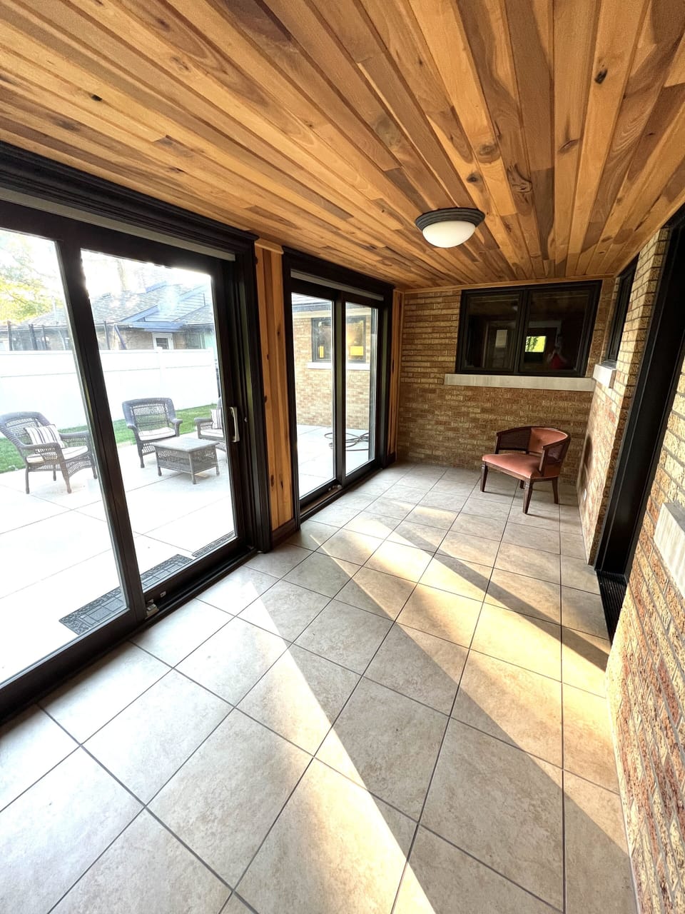 4 season room connects flexible office space and back patio