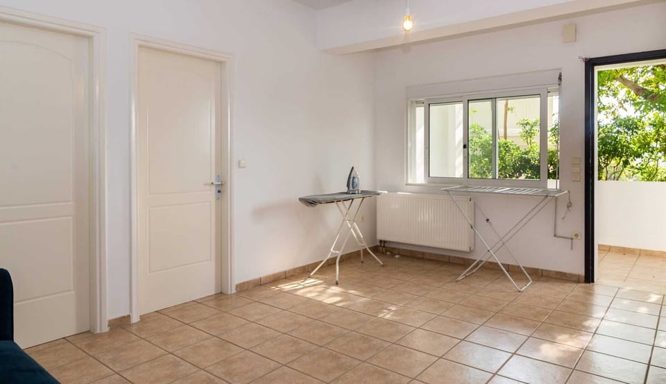 Ground floor laundry area with sofa bed