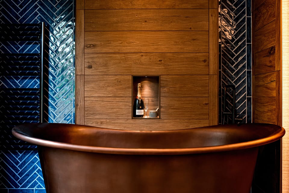 Superior Suite, Bathtub | Bathroom | Hair dryer, bathrobes, slippers, heated floors