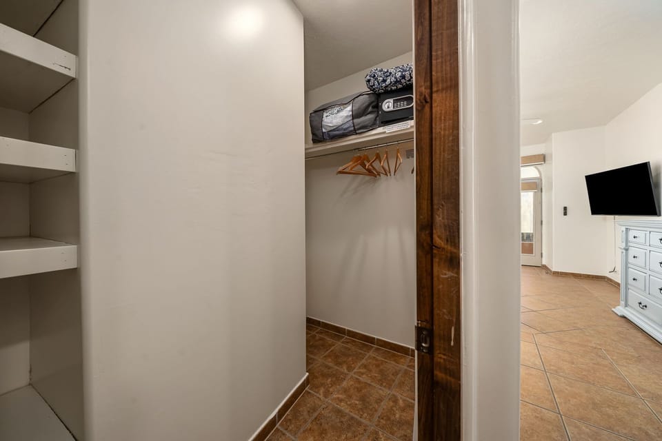 Convenient walk-in closet located off the master bedroom, perfect for extended stays and organized storage