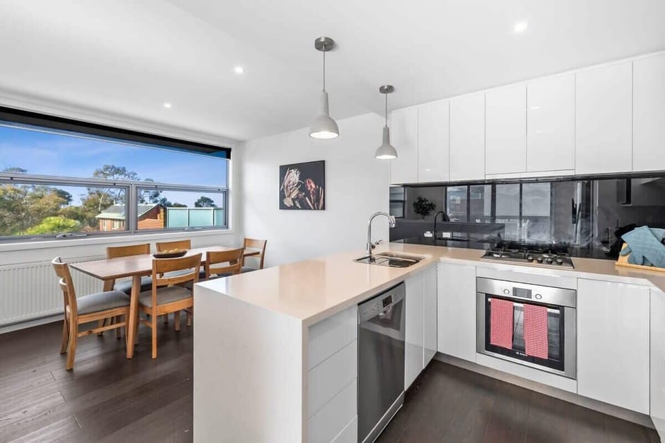 Kitchen and dining area boasting contemporary beach style