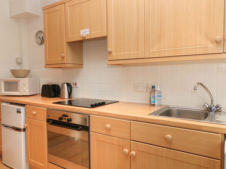 Fridge, electric kettle, toaster, cookware/dishes/utensils