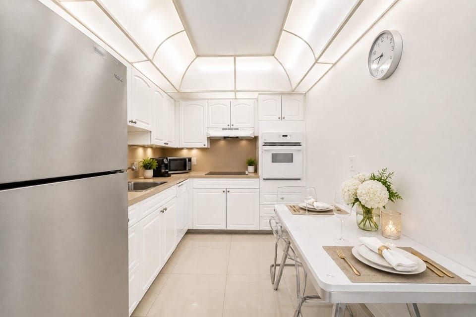 Gourmet kitchen featuring premium appliances, quartz countertops, and contemporary design