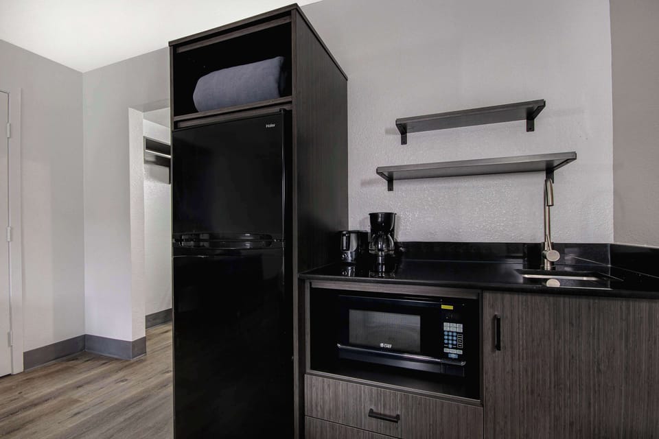 Full-size fridge, microwave, stovetop, coffee/tea maker