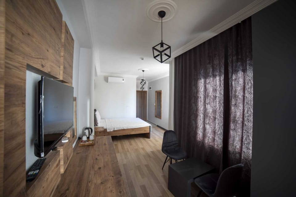 Family Suite | Minibar, in-room safe, desk, laptop workspace