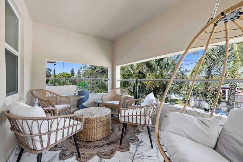 Relax on this comfortable tropical inspired seating area and hammock in the second floor balcony.