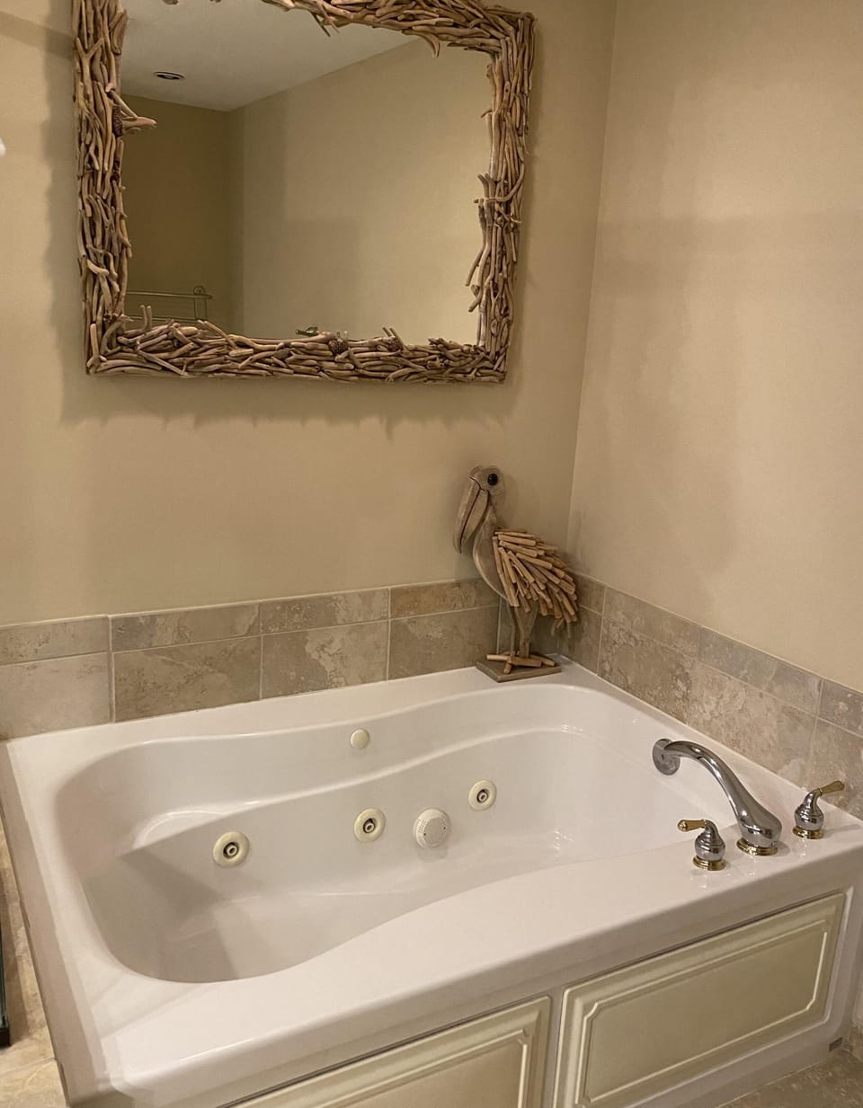 Relax in the spacious whirlpool tub with elegant decor bathroom