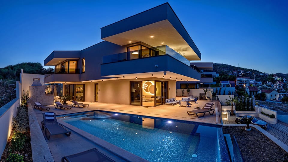 Night view of the villa and pool side