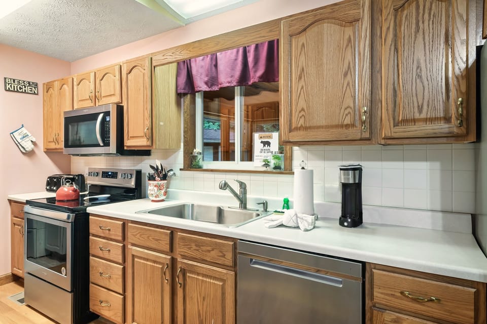 An oven, stovetop, microwave, dishwasher, fridge, and plenty of counter space!