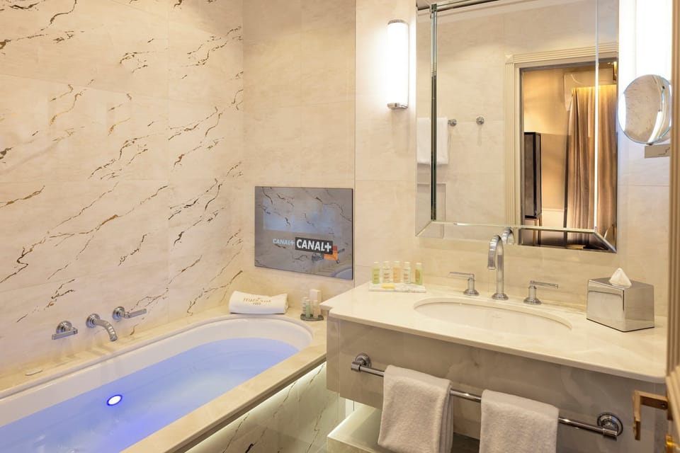 Designer toiletries, hair dryer, bathrobes, slippers
