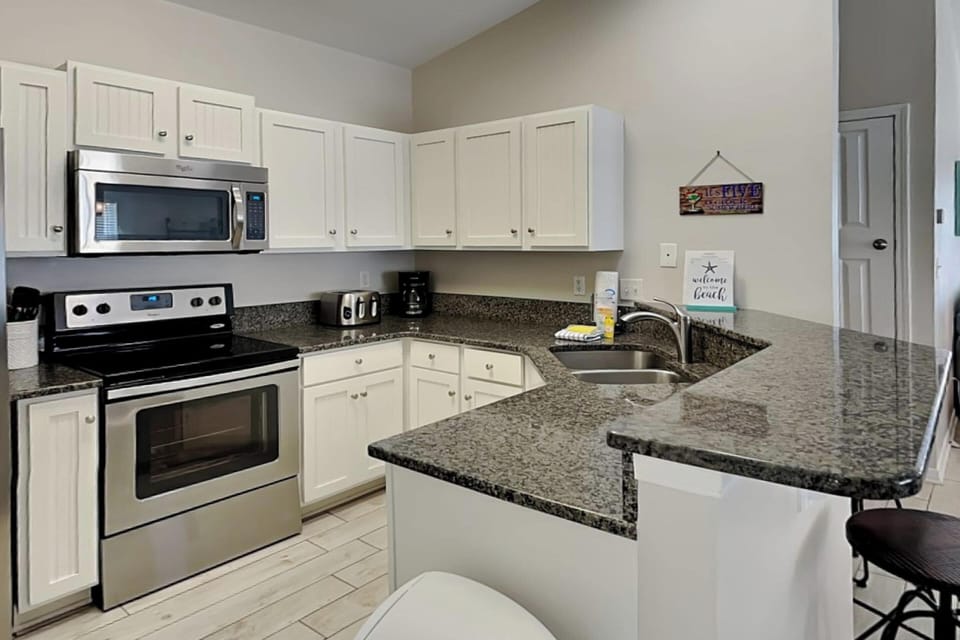 Studio, Multiple Beds, Kitchen, Garden View | Property amenity