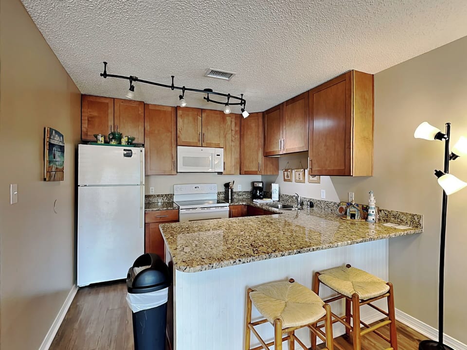 Condo, Multiple Beds, Balcony, Partial Sea View | Private kitchen | Fridge, microwave, oven, stovetop