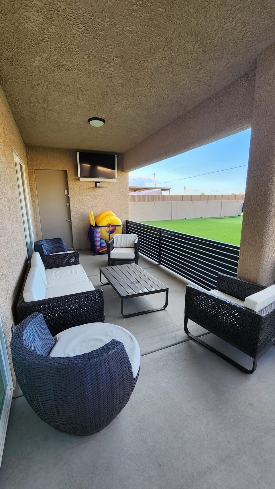 Outdoor Living Room With Large TV perfect to Watch Sporting Events 