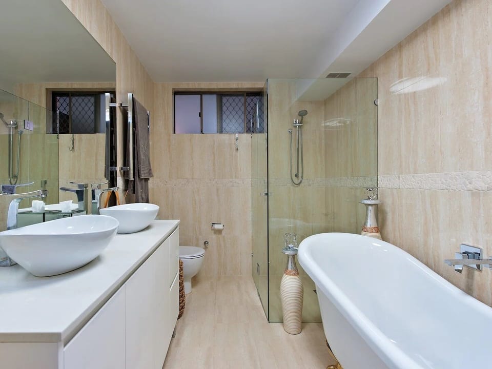 Main bathroom with claw bath, shower and toilet