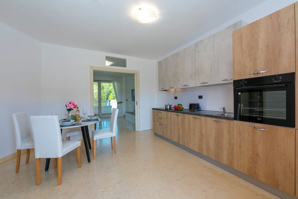 Family Apartment, 1 Bedroom, Balcony (Rivoltella Apt With Pool 600m From) | Private kitchen | Fridge, microwave, stovetop, dishwasher