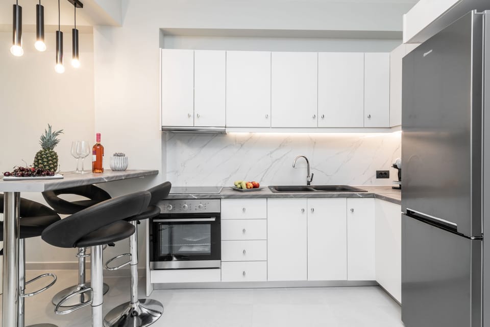 Deluxe Apartment | Private kitchen | Full-size fridge, oven, stovetop, espresso maker