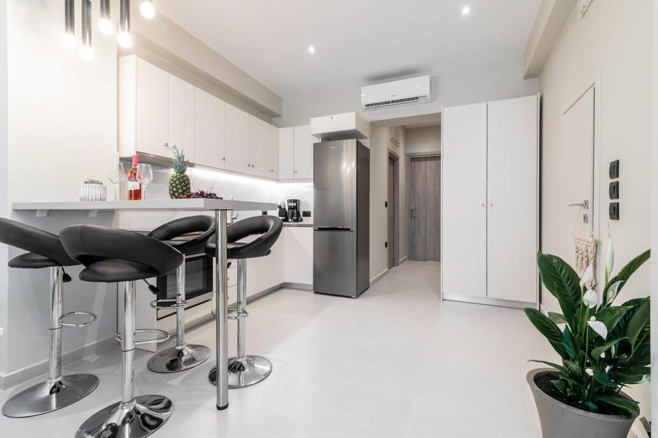Deluxe Apartment | Private kitchen | Full-size fridge, oven, stovetop, espresso maker