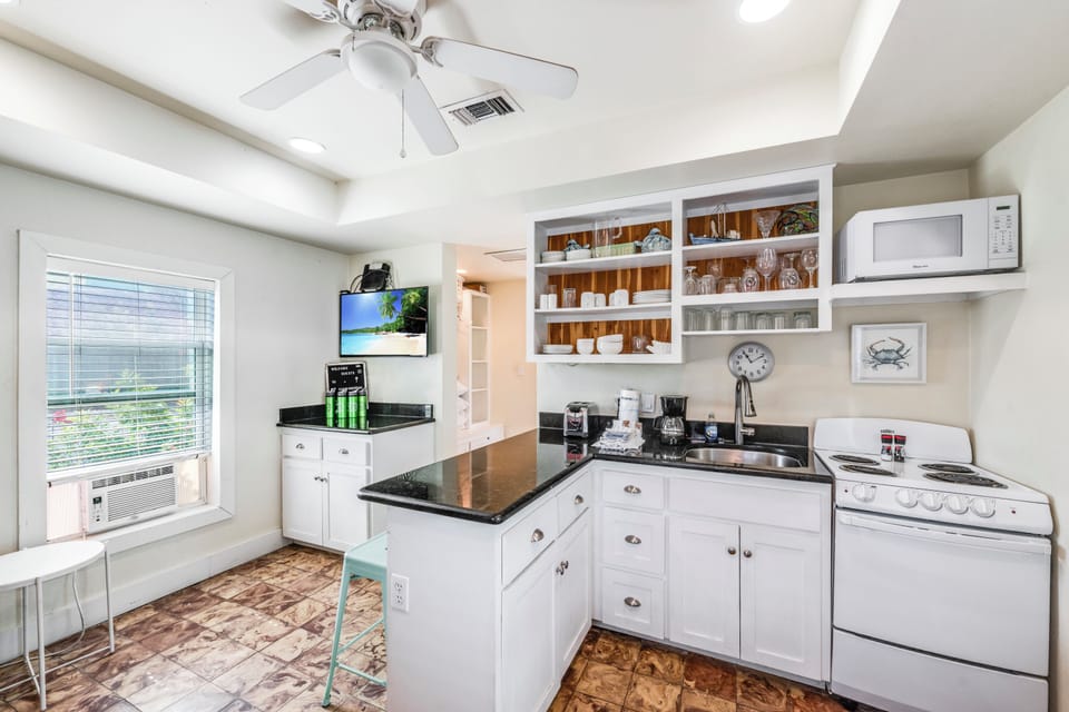 Your fully-equipped kitchen features everything you need for comfortable stays—from morning coffee to home-cooked meals.