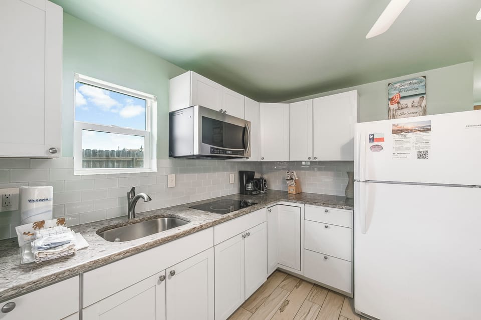 Your fully equipped kitchen features modern appliances and granite countertops, perfect for preparing meals during your stay.