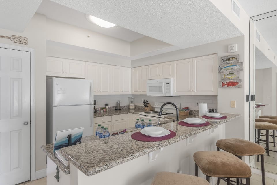 The updated kitchen has granite countertops and is fully stocked with more than the basics (coffee/tea bar, oils/spices, Tupperware, plenty of pots/pans/cookware) so you and your group can pre