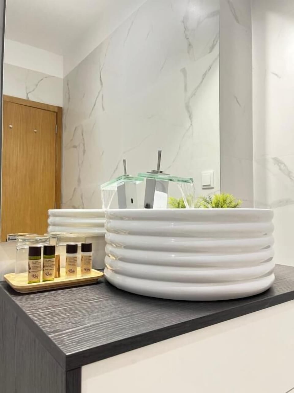 Deluxe Room | Bathroom | Designer toiletries, hair dryer, slippers, towels