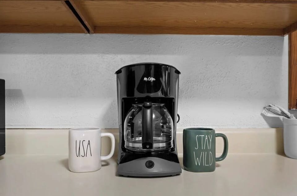 Drip coffee maker with coffee provided to get your morning started right.