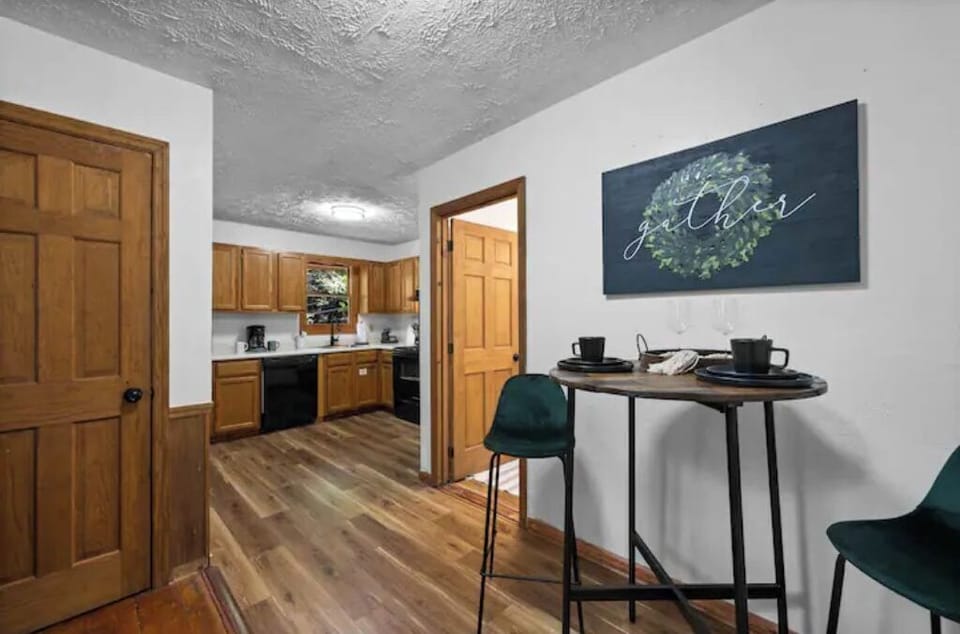 Dining area with brand new flooring leading to the fully stocked kitchen. 
