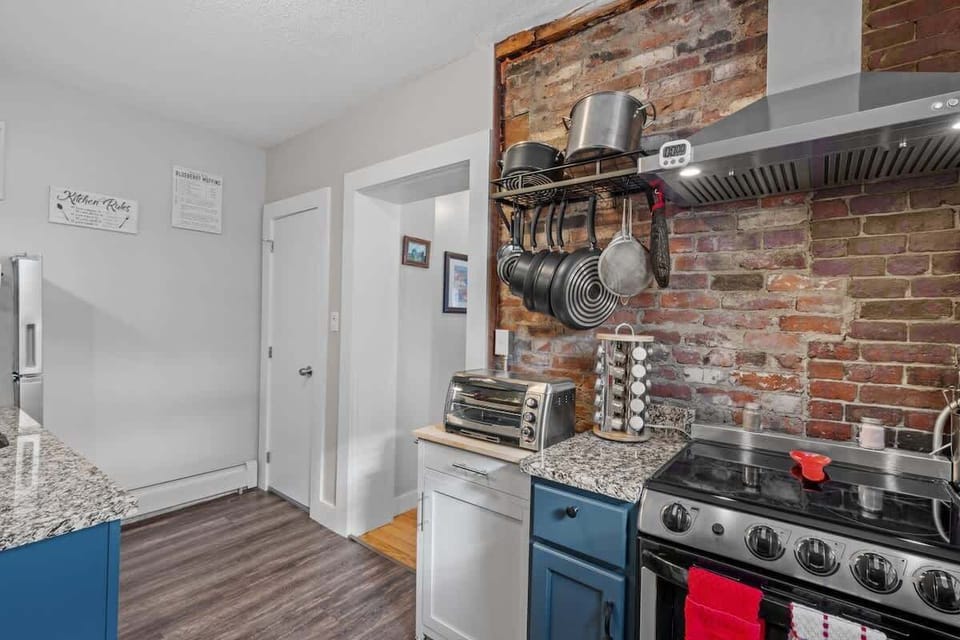 Unleash your culinary skills in the generously appointed kitchen, complete with stainless steel appliances, granite countertops, and an array of essential cooking tools and spices.